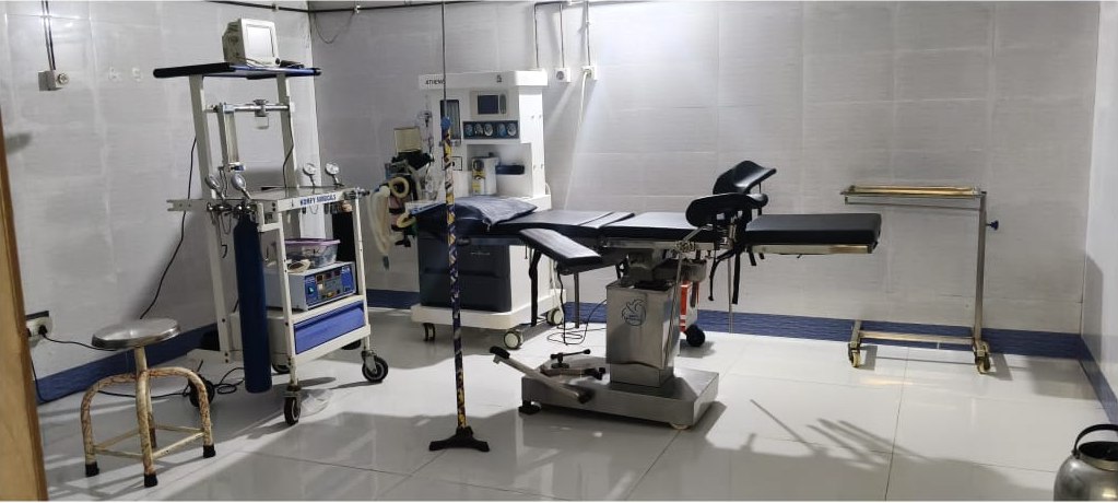 Operation theatre with surgical table and equipment at Amma Vaidyashala